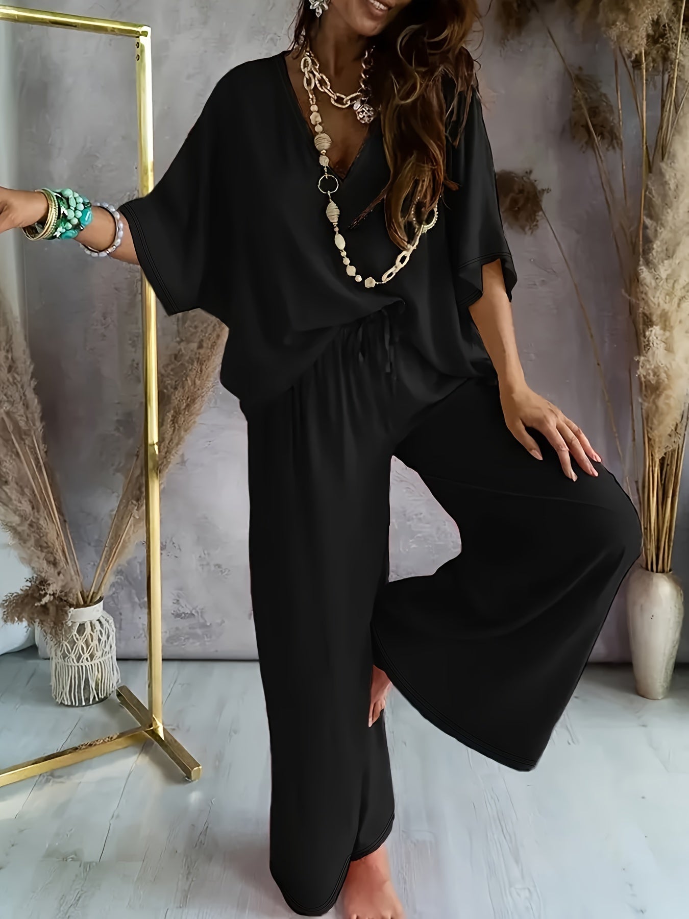 Damen Jumpsuit mit weitem Bein und V-Ausschnitt – Eleganter Freizeit Overall für Frühling und Sommer