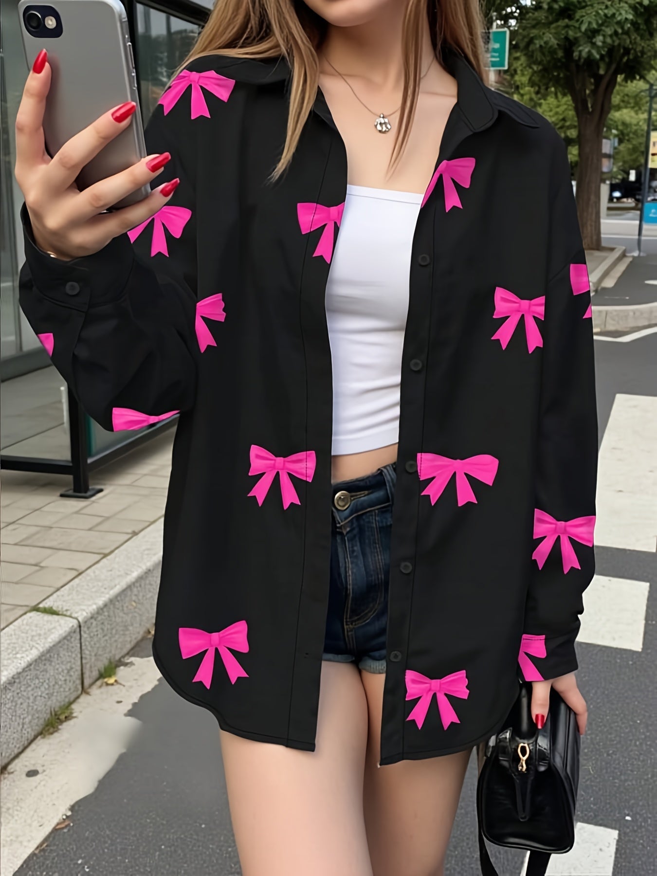 Camisa de mujer de manga larga con estampado de lazos en negro y rosa
