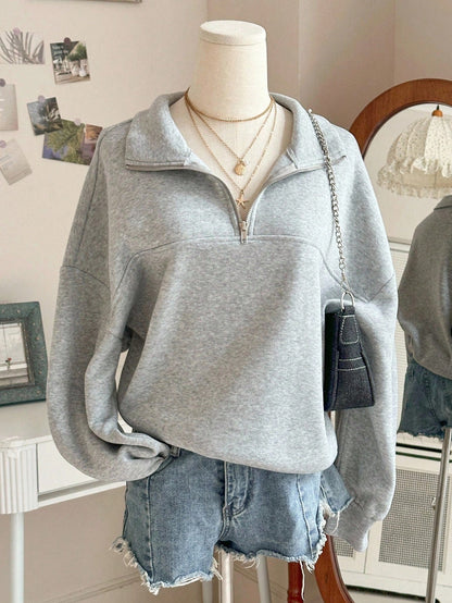 Grijze sweater met ritskraag