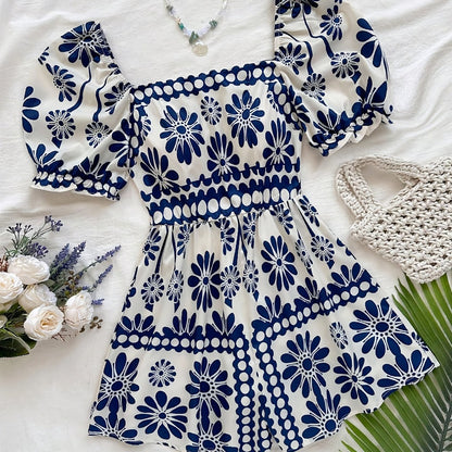 Dame vintage-jumpsuit med pufærmer og blomsterprint – Elegant heldragt til sommer og fritid