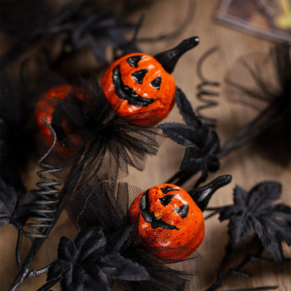 Rami decorativi con zucche di Halloween per decorazioni spaventose di festa e tavolo