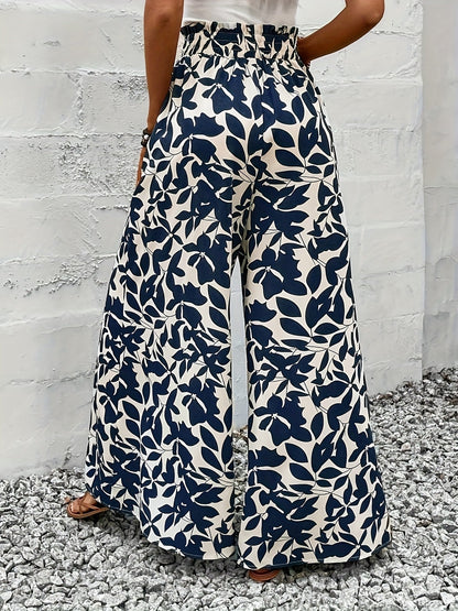 Damskie szerokie spodnie paperbag z botanicznym nadrukiem – elegancki styl boho na co dzień i na wakacje