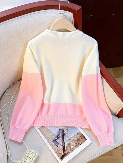 Dame-sweatshirt i creme-rosa, tofarvet med rosenprint og ribmanchetter