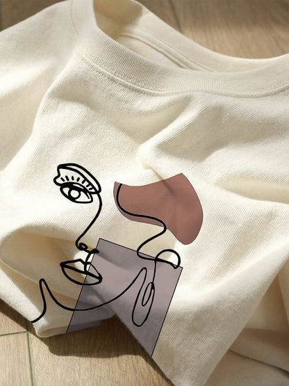 Damen T-Shirt mit abstraktem Gesicht Print – Modernes Kunst Casual Shirt für Alltag & Freizeit