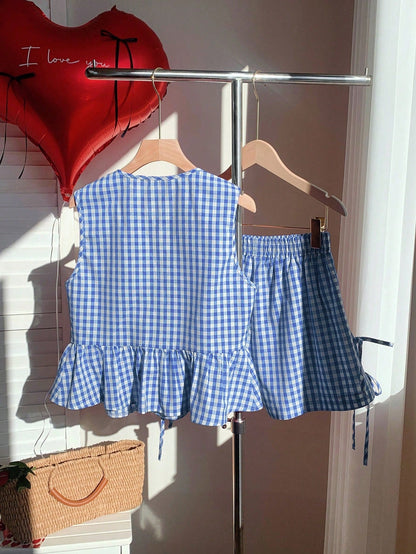 Damset med två delar med ränder – ärmlös volangtopp och shorts med rosetter, sommarstil