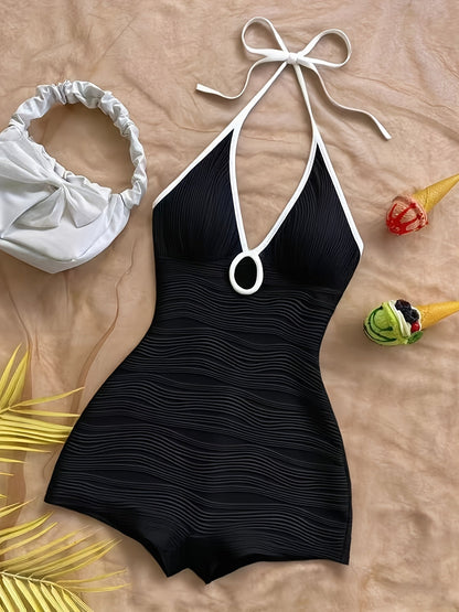 Dam baddräkt i ett stycke med vågmönster och halterneck – elegant retrostil för strand och pool