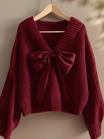 Pullover da donna in maglia grossa con scollo a V e grande fiocco