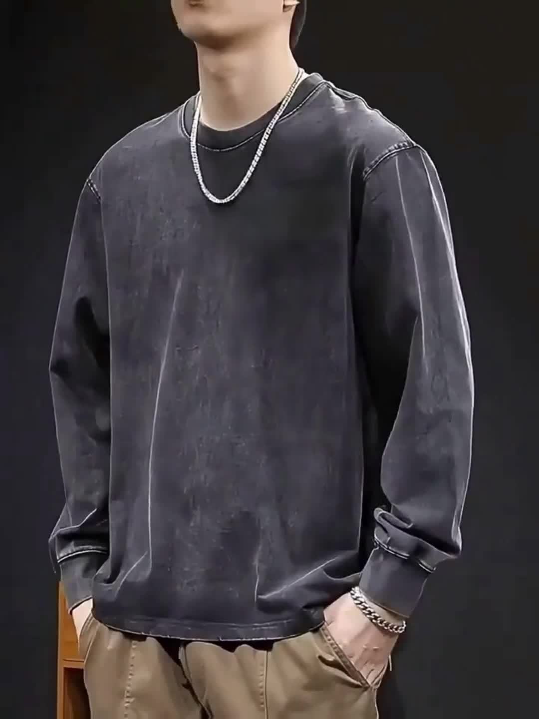 Unisex-langærmet T-shirt i sort med vasket look, stjernemotiv og oversize-pasform