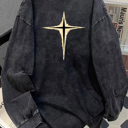 Unisex-langærmet T-shirt i sort med vasket look, stjernemotiv og oversize-pasform