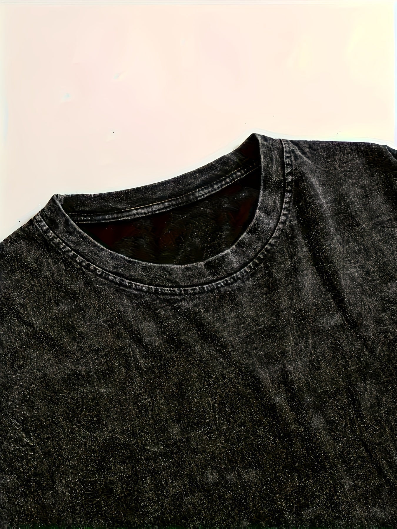 Unisex-langærmet T-shirt i sort med vasket look, stjernemotiv og oversize-pasform