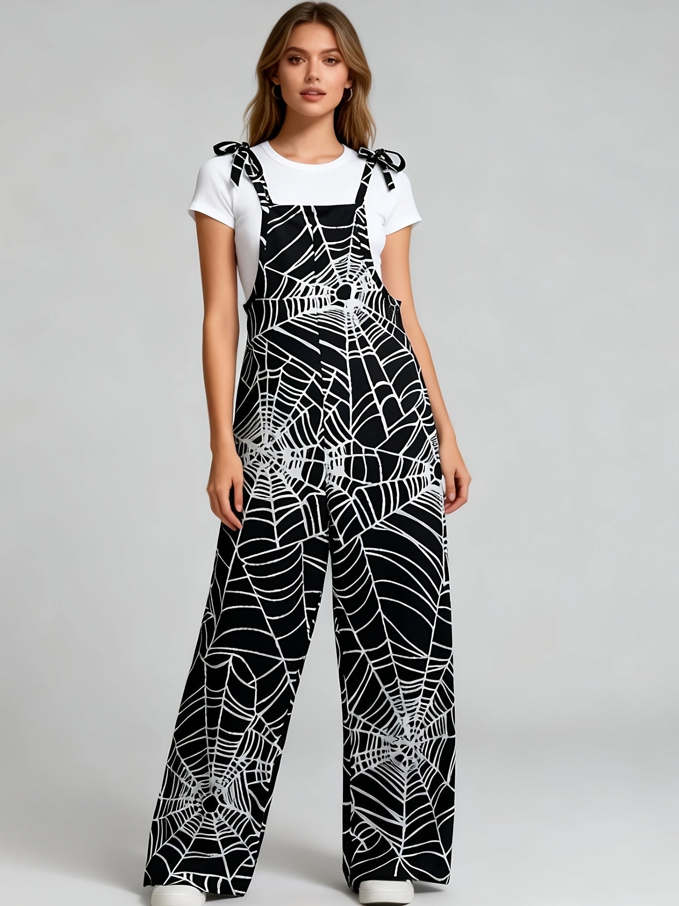 Damen Jumpsuit Spinnennetz-Muster Schwarz Trägerhose