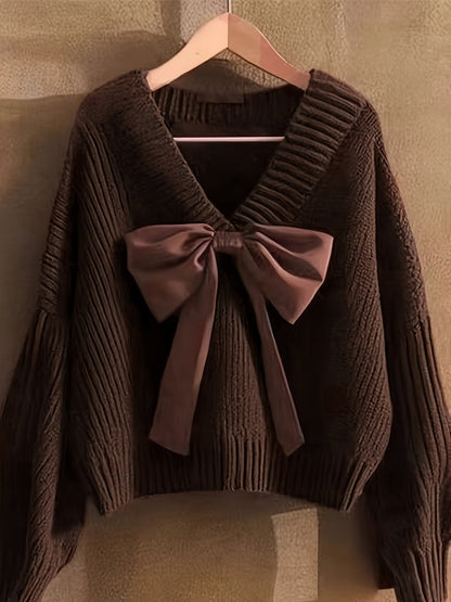 Pullover da donna in maglia grossa con scollo a V e grande fiocco