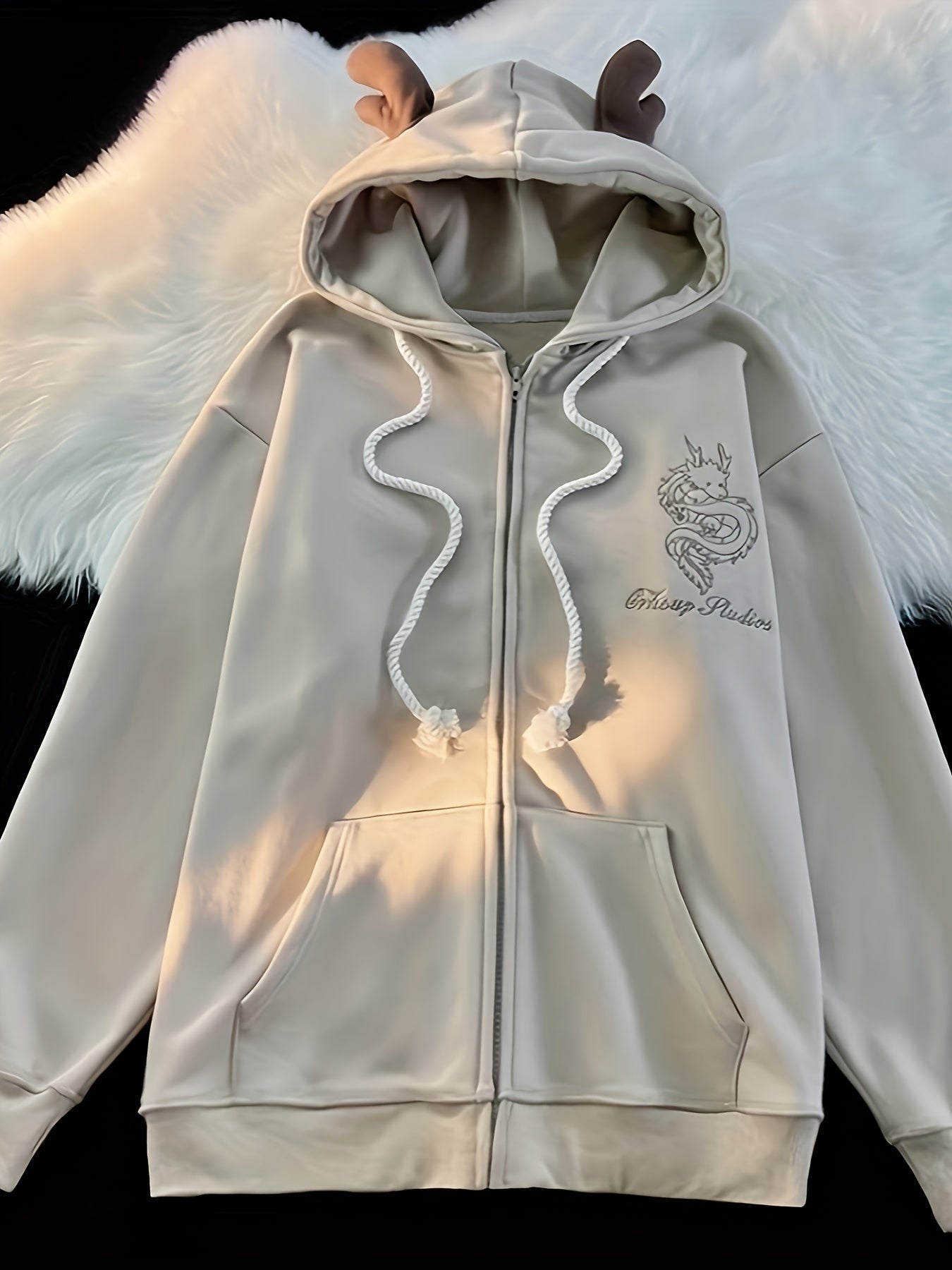 Uniseks hoodie met ritssluiting en capuchon, drakenborduursel en rendiergeweiën
