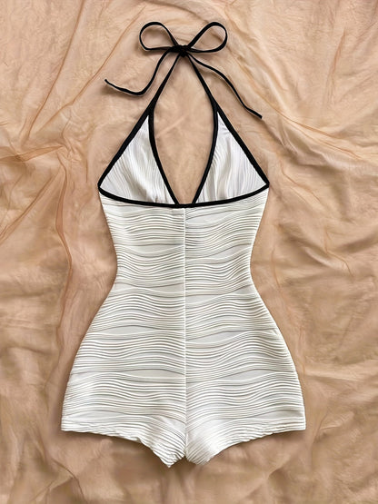 Dam baddräkt i ett stycke med vågmönster och halterneck – elegant retrostil för strand och pool