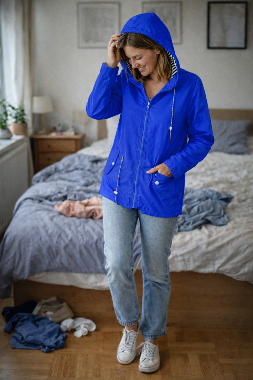 Regenjas voor dames met lange mouwen, capuchon en zakken