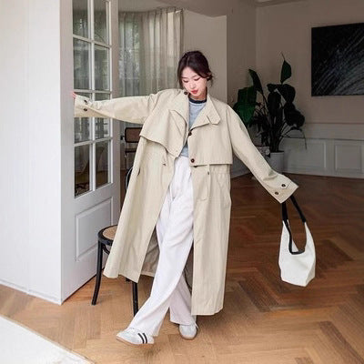 Oversized trenchcoat voor dames met cape op de rug en koord in de taille