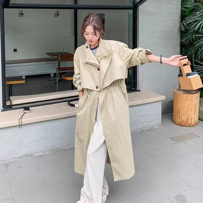 Oversized trenchcoat voor dames met cape op de rug en koord in de taille
