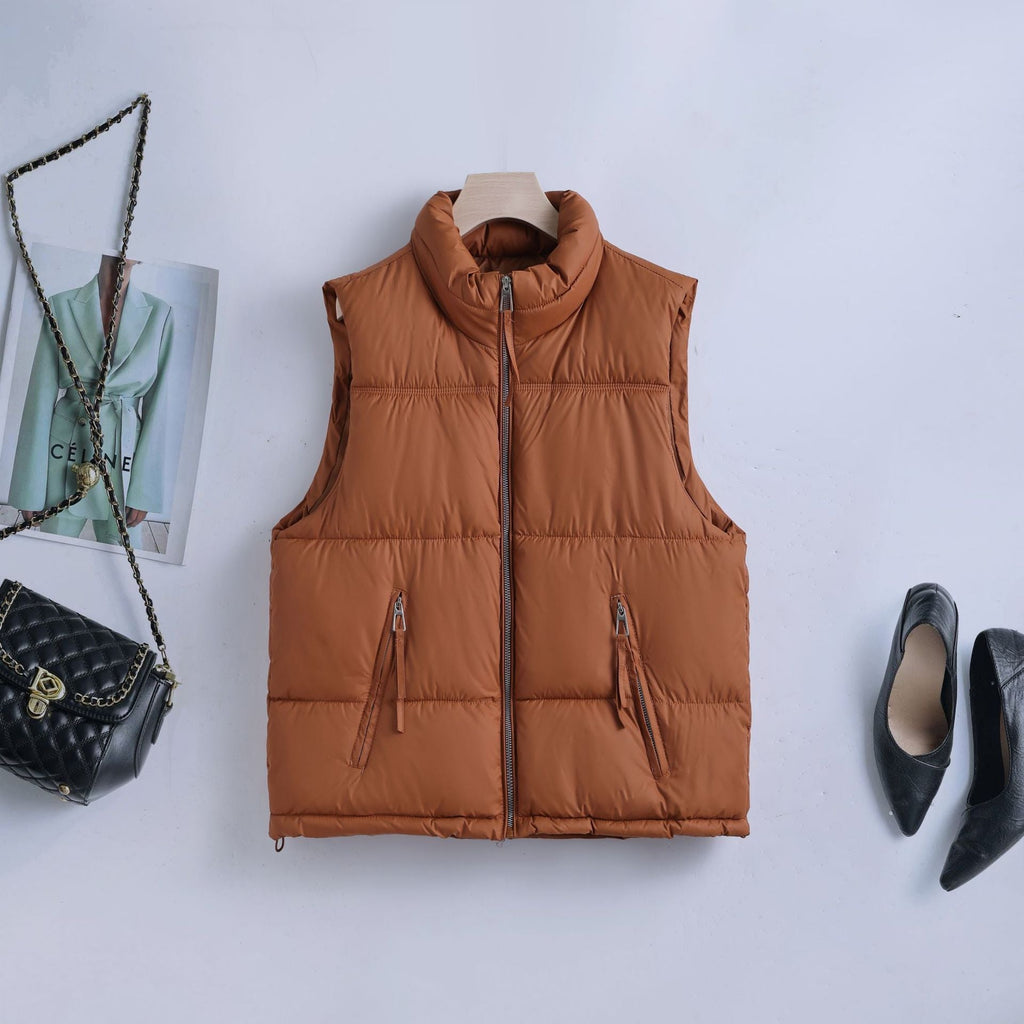 Gewatteerde bodywarmer voor dames met hoge opstaande kraag en tweewegrits