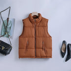 Gewatteerde bodywarmer voor dames met hoge opstaande kraag en tweewegrits