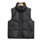 Gewatteerde bodywarmer voor dames met hoge opstaande kraag en lusjes met sierringen