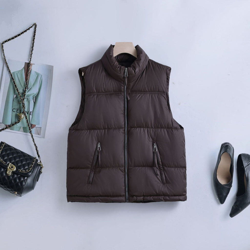 Gewatteerde bodywarmer voor dames met hoge opstaande kraag en tweewegrits