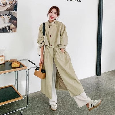 Oversized trenchcoat voor dames met cape op de rug en koord in de taille