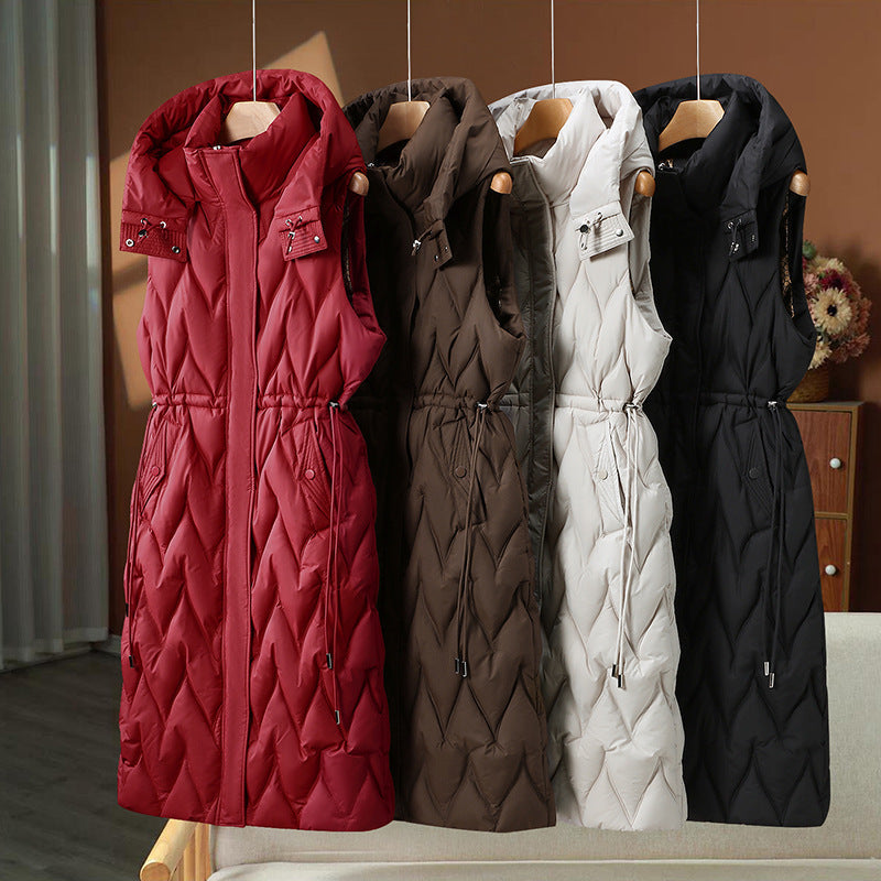 Lange gewatteerde bodywarmer voor dames met capuchon en koord in de taille