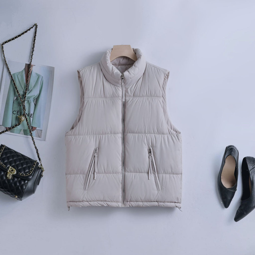 Gewatteerde bodywarmer voor dames met hoge opstaande kraag en tweewegrits