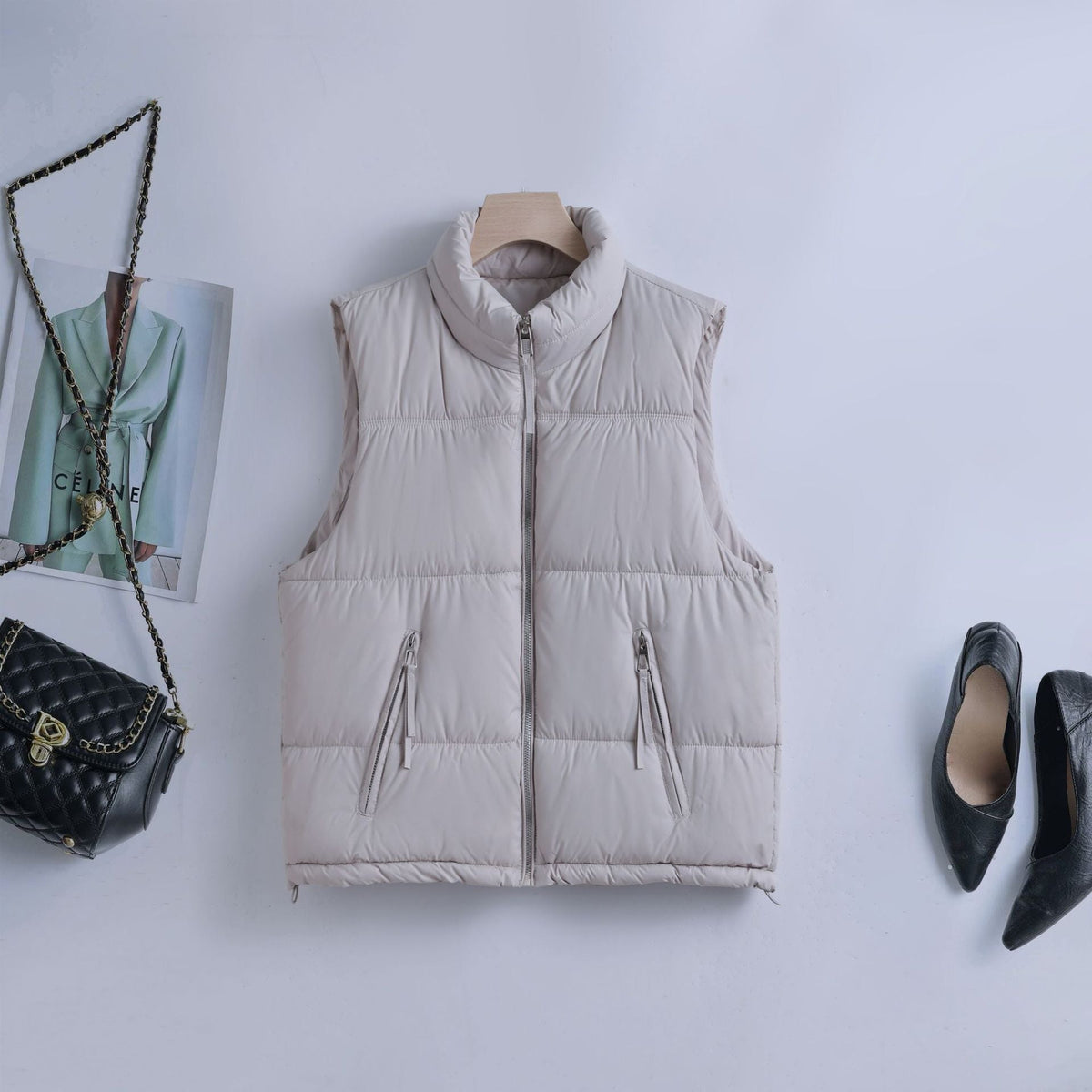 Gewatteerde bodywarmer voor dames met hoge opstaande kraag en tweewegrits