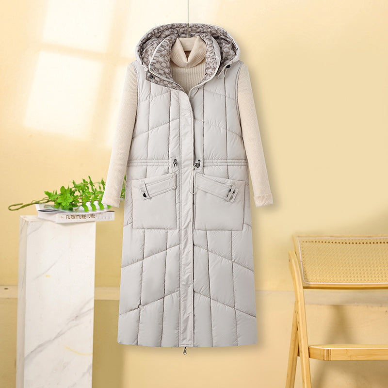Lange gewatteerde bodywarmer voor dames met capuchon en multifunctionele zakken