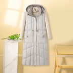 Lange gewatteerde bodywarmer voor dames met capuchon en multifunctionele zakken