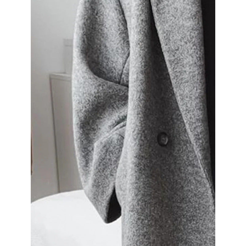 Oversized mantel voor dames met revers en dubbele knopenrij