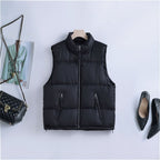 Gewatteerde bodywarmer voor dames met hoge opstaande kraag en tweewegrits