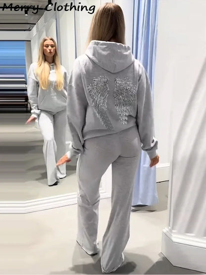 Sweat à capuche pour femme avec ailes à paillettes dans le dos
