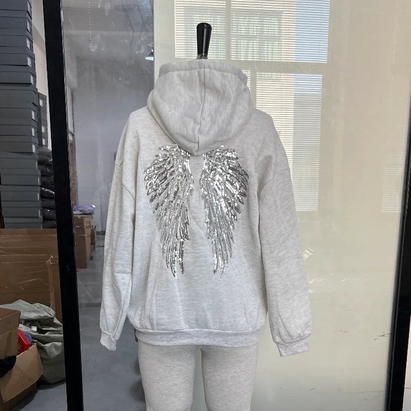Sweat à capuche pour femme avec ailes à paillettes dans le dos