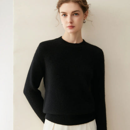Damesweater med rund hals, lange ærmer, blødt materiale og ensfarvet design