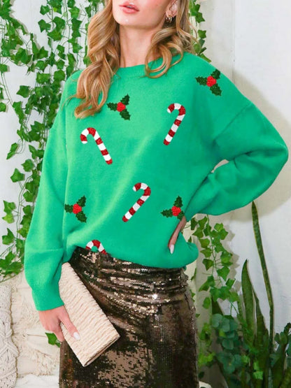 Pullover verde con motivi natalizi, scollo rotondo