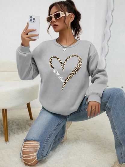 Sweat-shirt bleu pour femme avec imprimé cœur léopard, col rond et manches longues