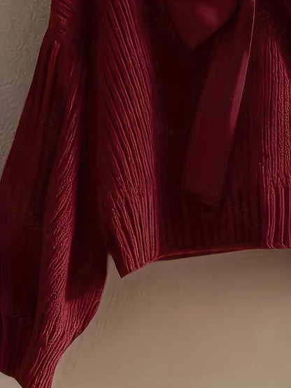 Pullover da donna in maglia grossa con scollo a V e grande fiocco