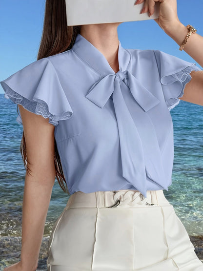Damska bluzka z rękawami motylkowymi i kołnierzem z kokardą – Elegancki look do biura i na lato