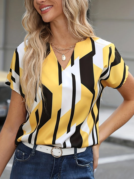 Dame vintagebluse med geometrisk mønster og V-hals – elegant sommermote for hverdag og kontor