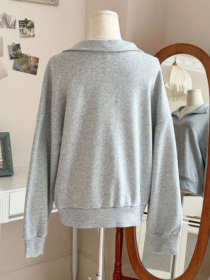 Grijze sweater met ritskraag