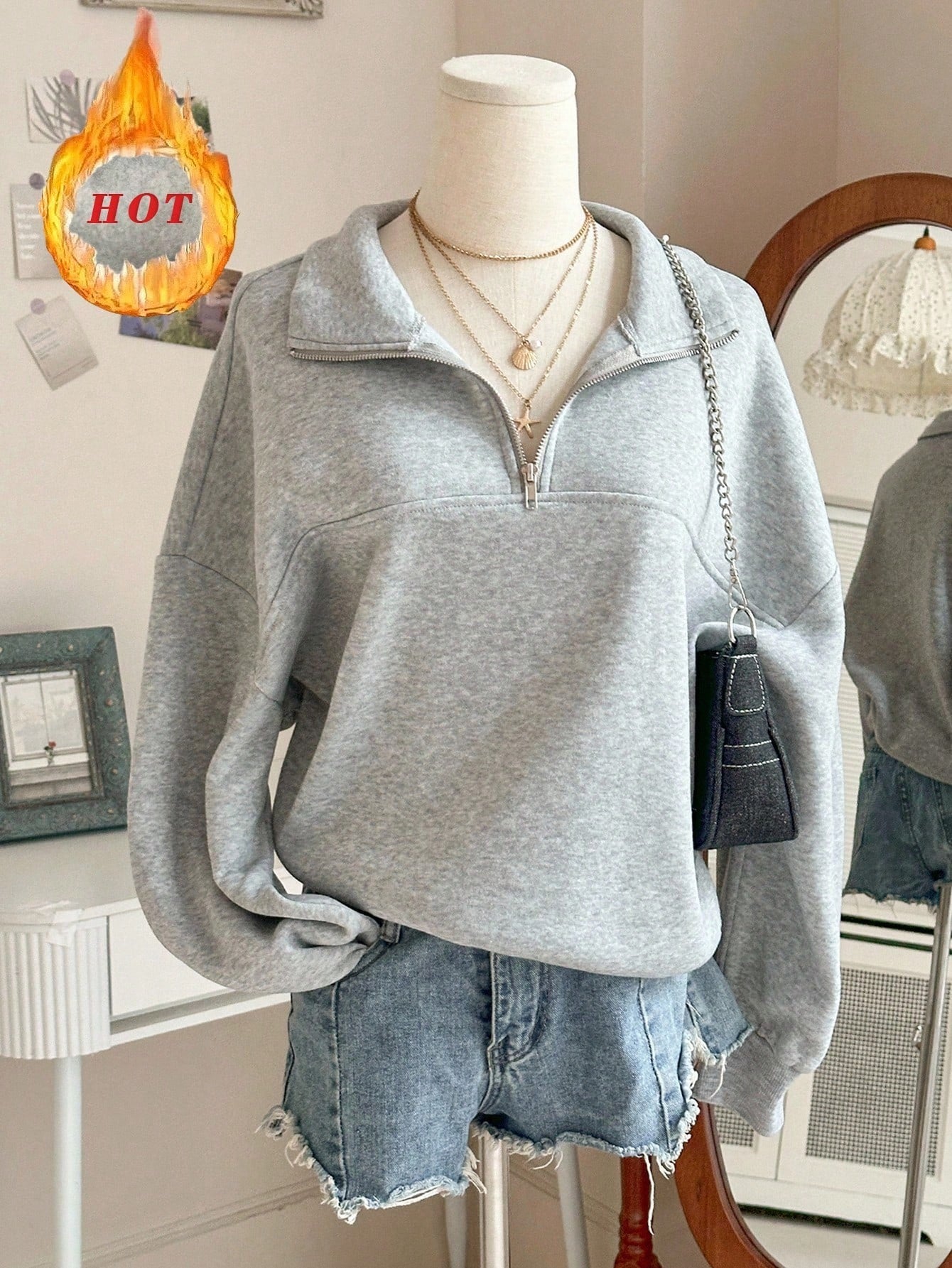 Grijze sweater met ritskraag