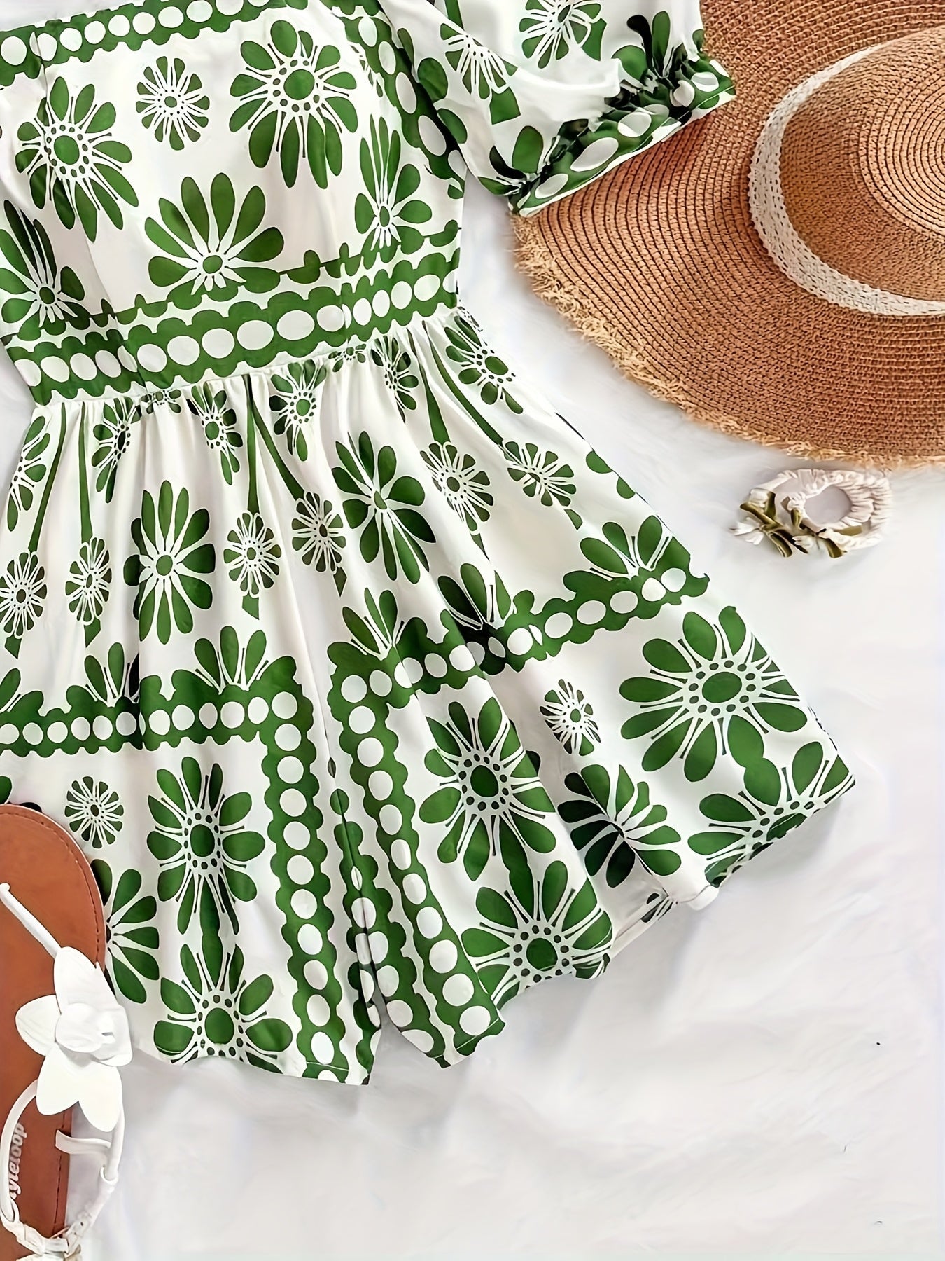 Dame vintage-jumpsuit med pufærmer og blomsterprint – Elegant heldragt til sommer og fritid