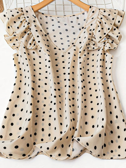 Damblus med polka dots, volangärmar och V-ringning – elegant, feminin stil för kontor och fritid