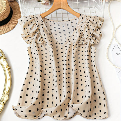 Damblus med polka dots, volangärmar och V-ringning – elegant, feminin stil för kontor och fritid