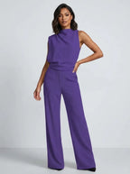Mouwloze jumpsuit met hoge hals, wijde pijpen en zakken voor dames